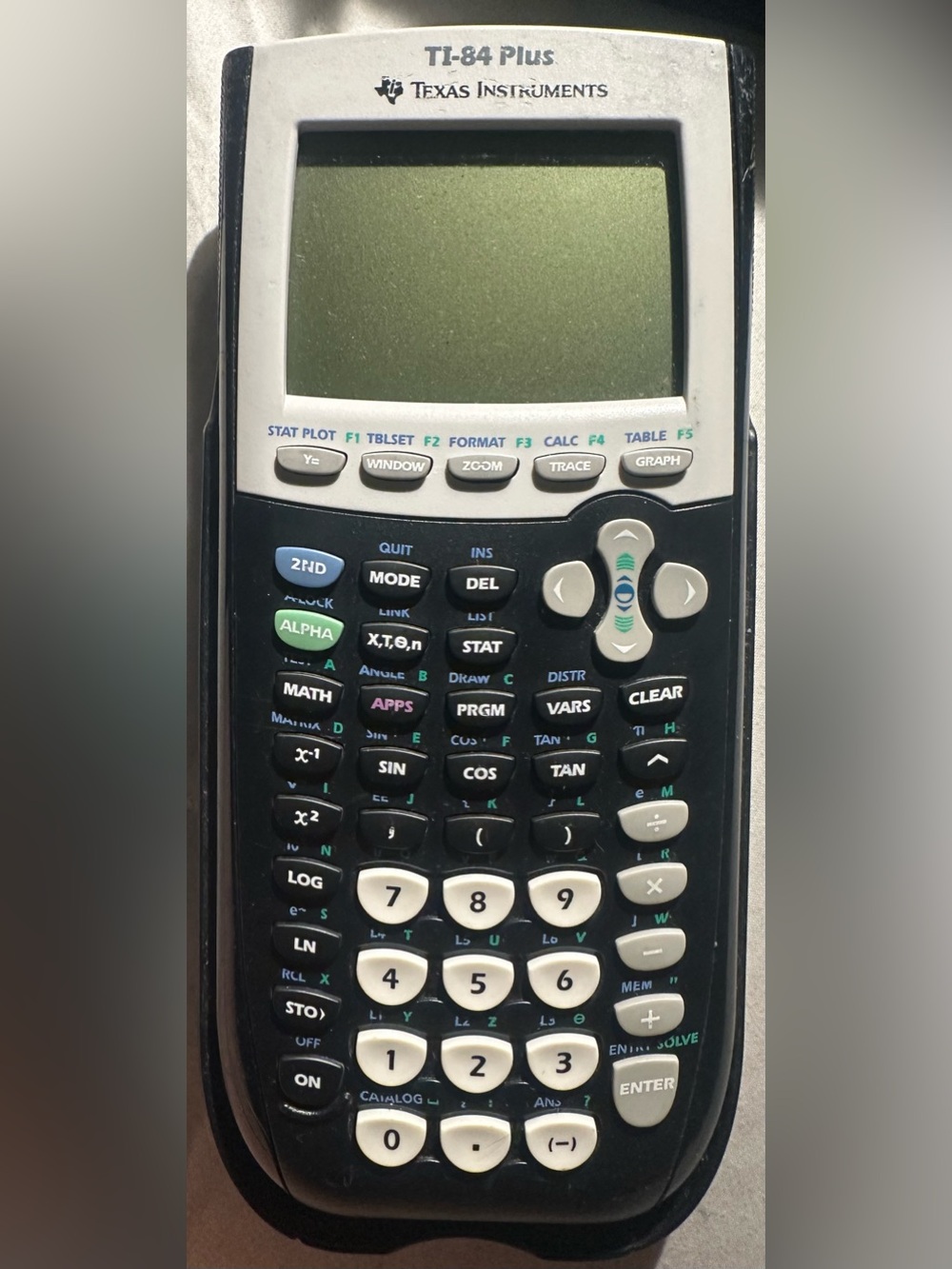 Texas Instruments TI-84 Plus Black Calculator with White Keys and Green Accents